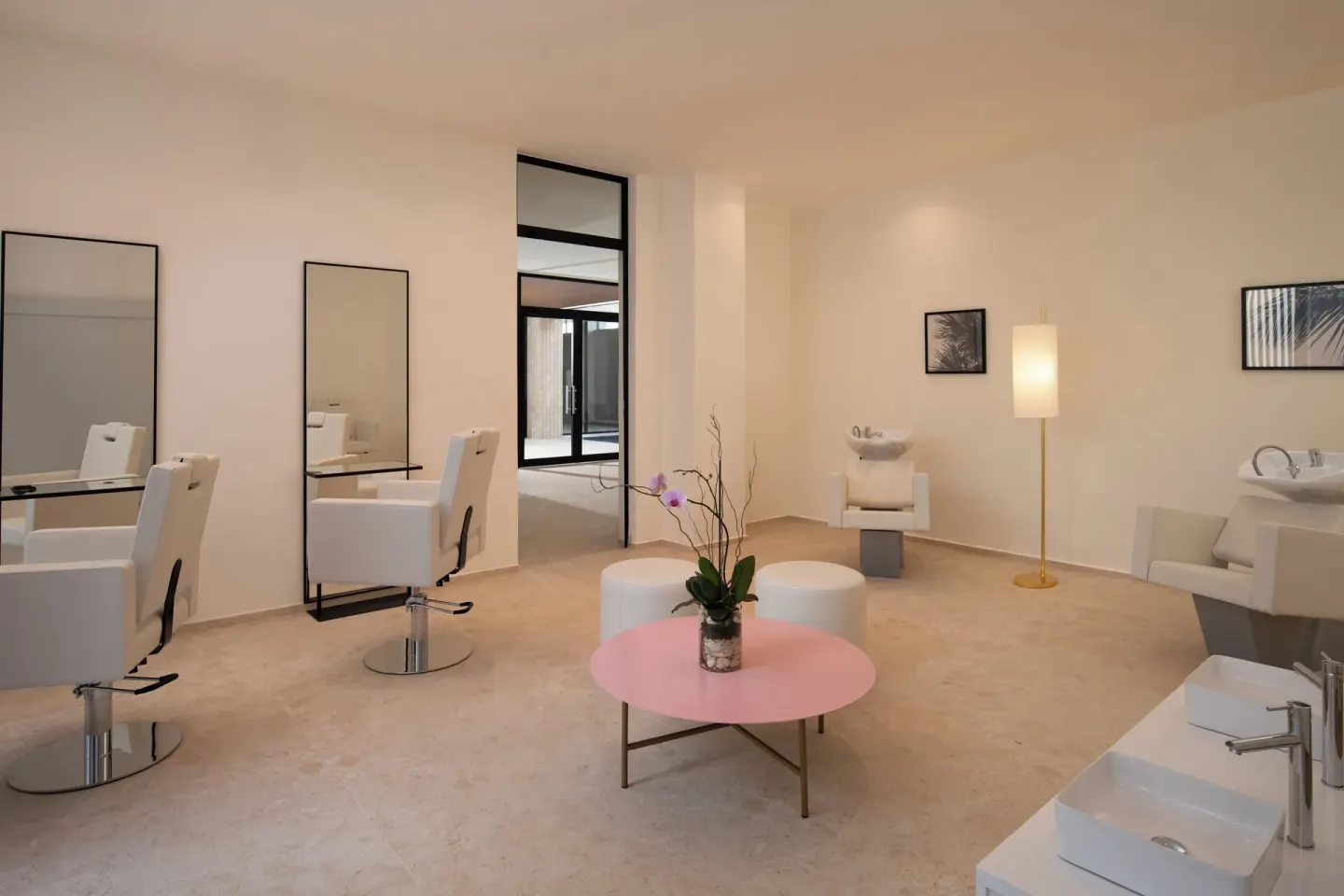 Salon-style treatment area with white chairs and mirrors at Live Aqua Punta Cana.