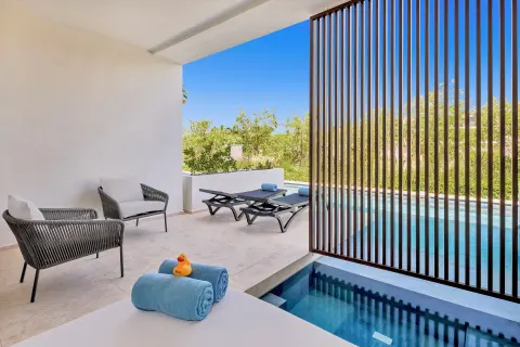 Aqua Junior Suite shaded swim-up terrace at Live Aqua Punta Cana.