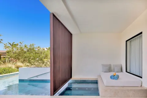 Aqua Junior Suite Swim-Up Pool View terrace daybed at Live Aqua Punta Cana.