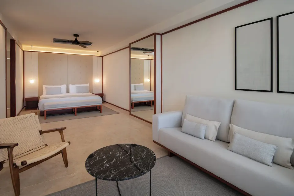 Fuego Suite Partial Ocean View seating and king bed at Live Aqua Punta Cana.