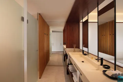 Double vanity bathroom in a Junior Suite Deluxe Pool View at Live Aqua Punta Cana.