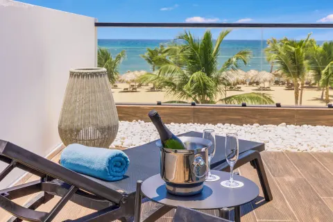 Viento Suite Ocean Front terrace loungers and sea view at Live Aqua Punta Cana.