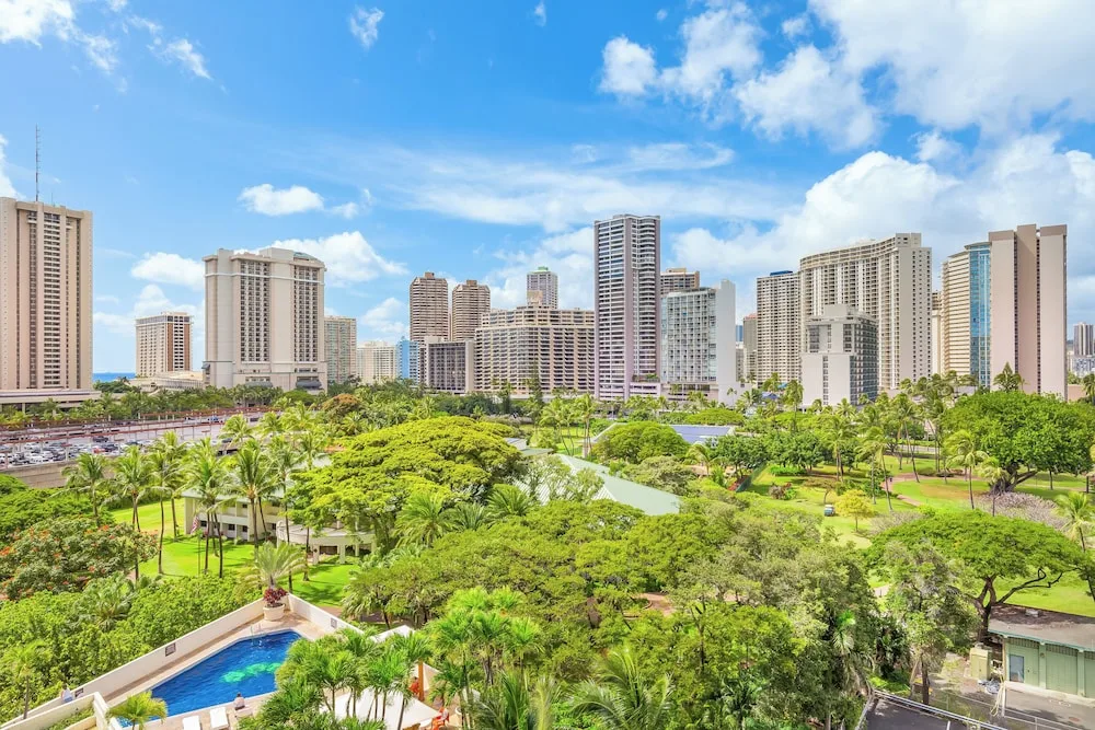 Mezzanine Level Studio Suite at Luana Waikiki Hotel & Suites with elevated city skyline views and modern studio layout in Waikiki, Honolulu.