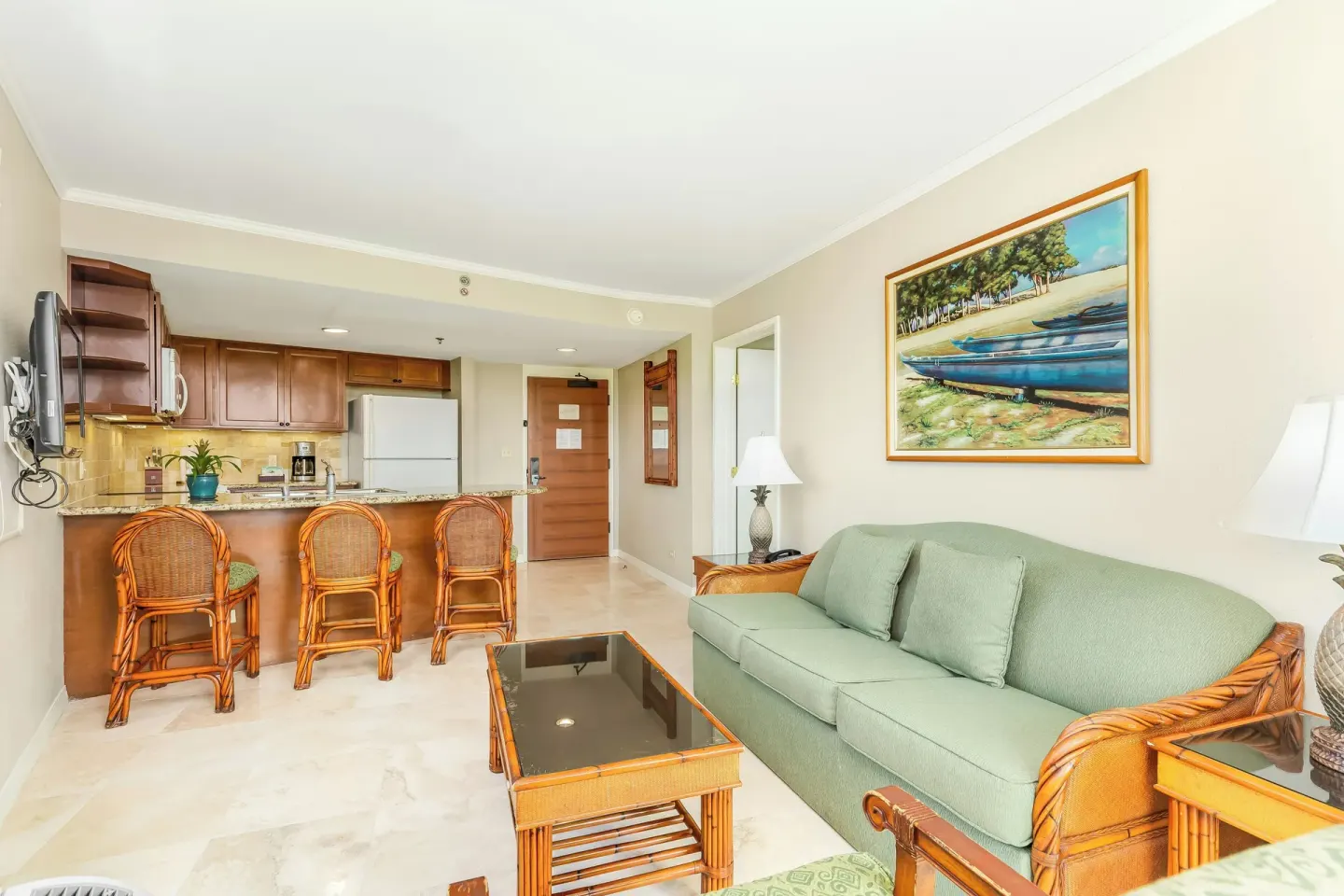 One-bedroom kitchen suite living area with sofa bed at Luana Waikiki Hotel & Suites.