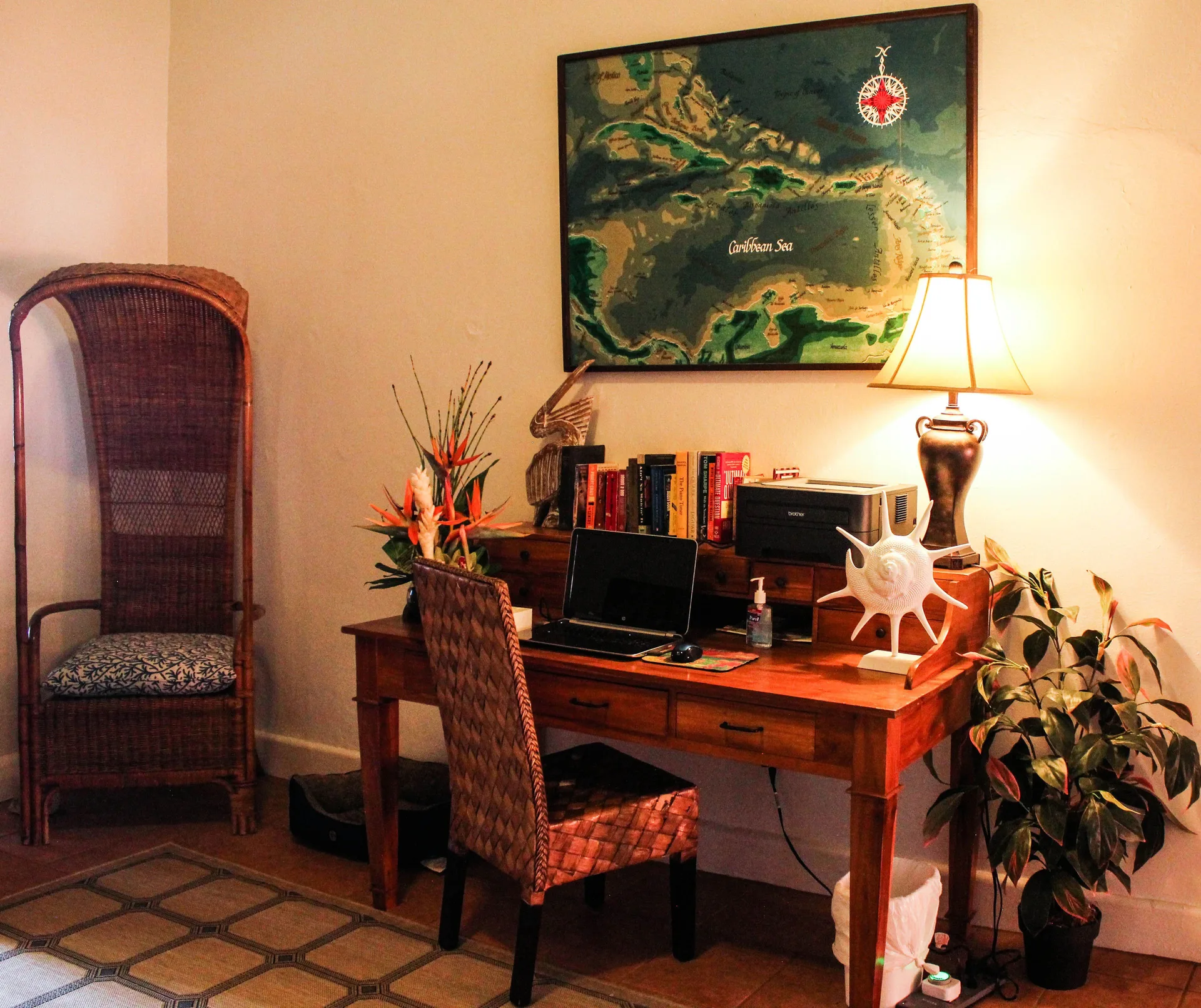 Guest computer desk with Caribbean map and wicker chair at Mafolie Hotel.