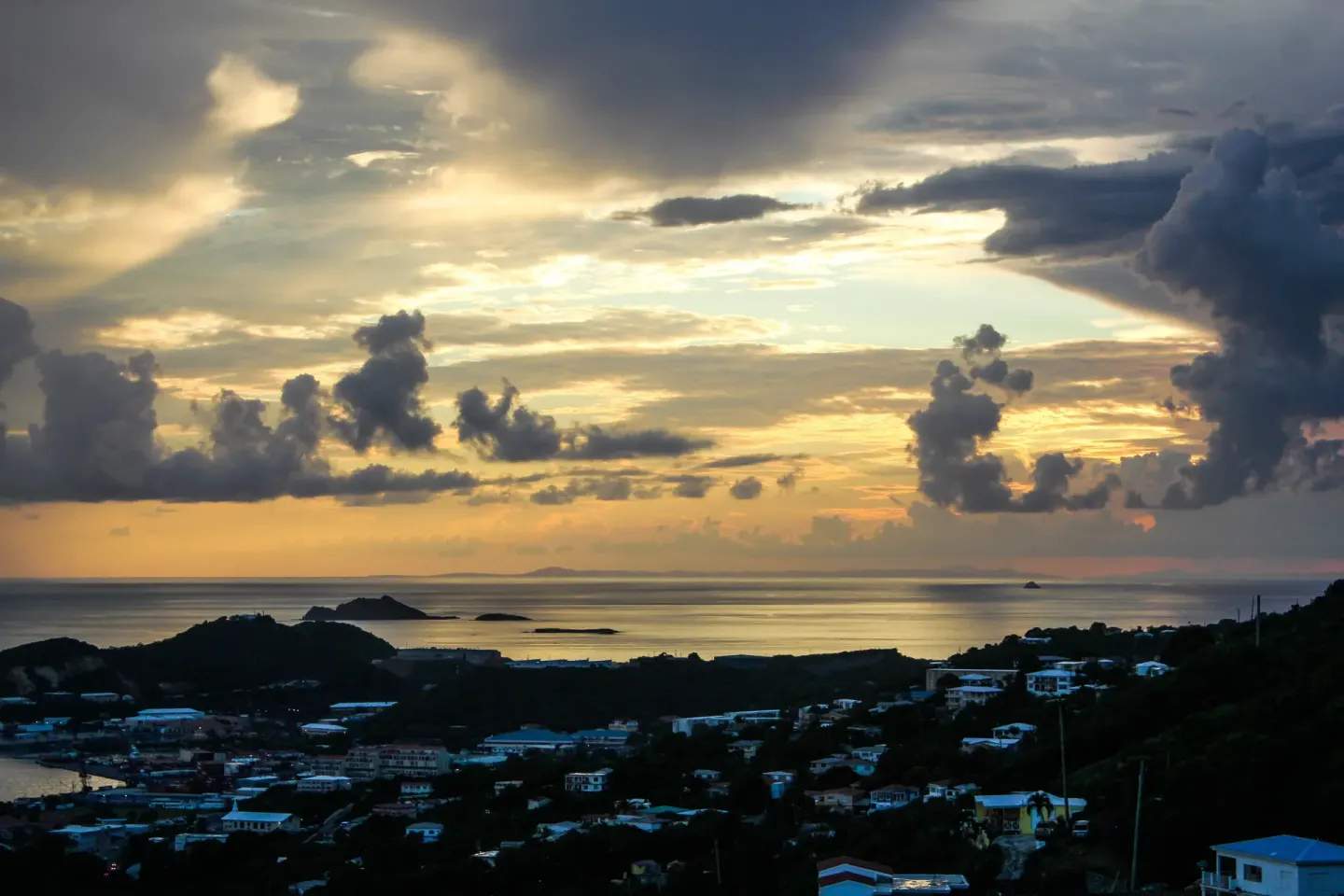 A dramatic sunset over the islands and sea near Mafolie Hotel.