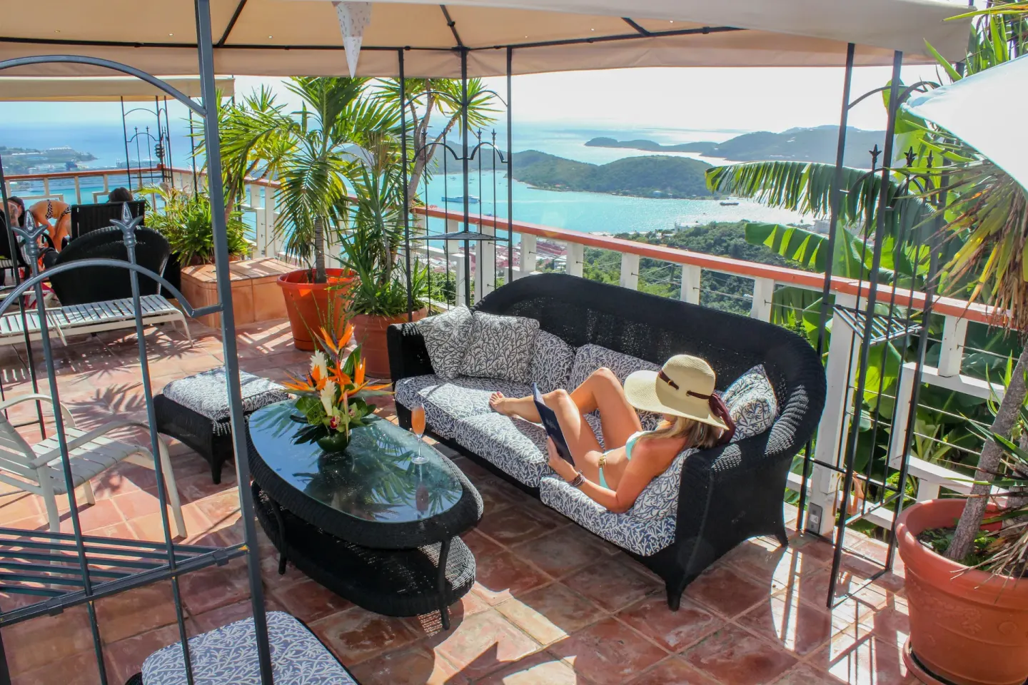 A shaded terrace lounge overlooks the bay at Mafolie Hotel.