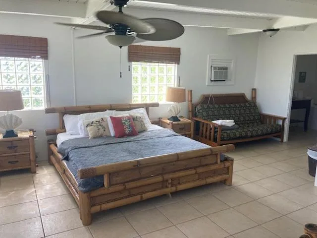 Bungalow room with a bamboo king bed and futon at Mafolie Hotel.