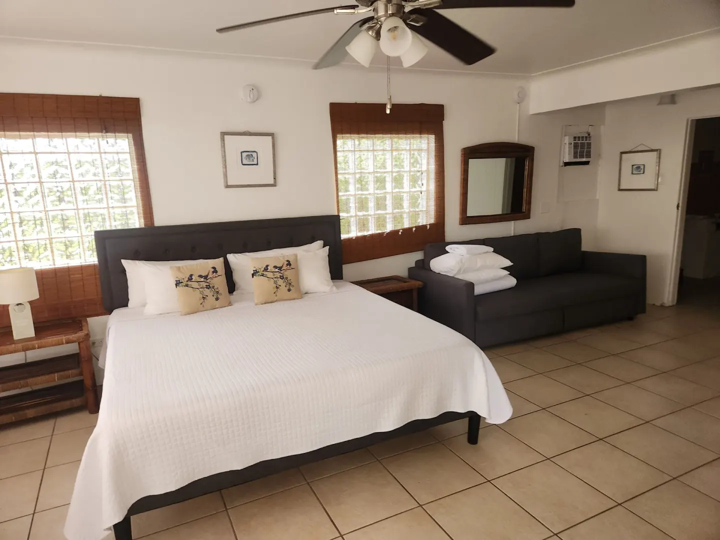 Bungalow room with a king bed and sofa at Mafolie Hotel.