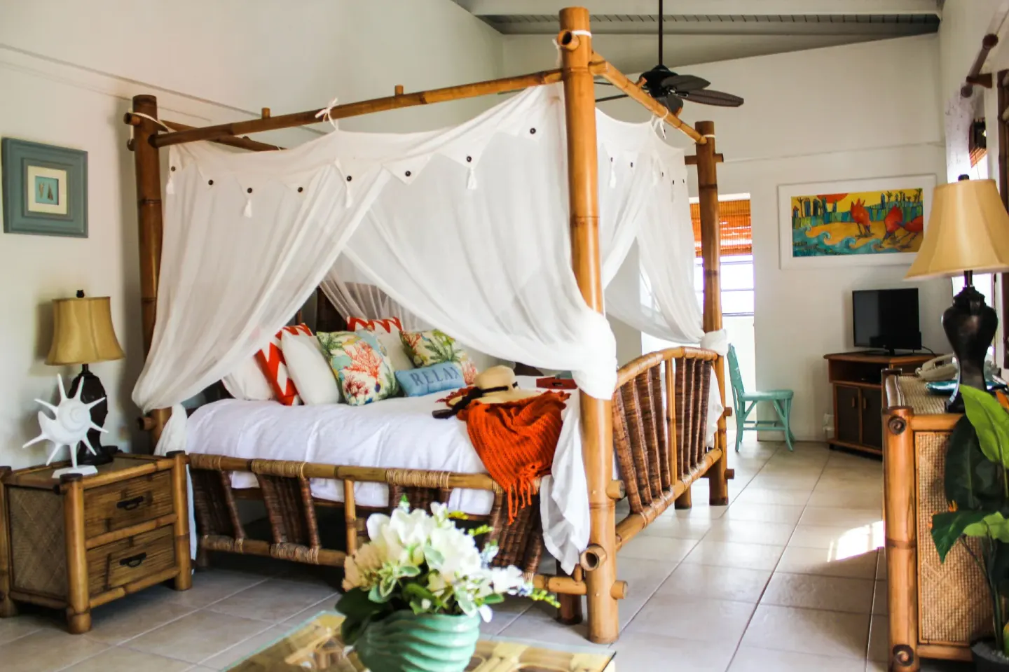 Junior Suite Harbor View with canopy bed and bamboo furnishings at Mafolie Hotel.
