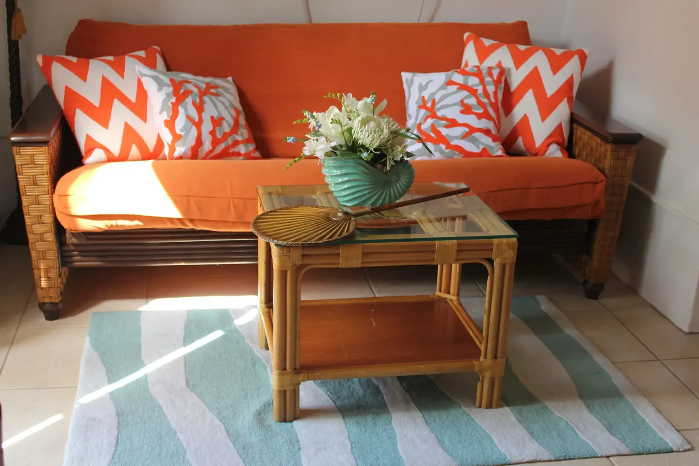 Junior Suite Harbor View sitting area with orange sofa at Mafolie Hotel.