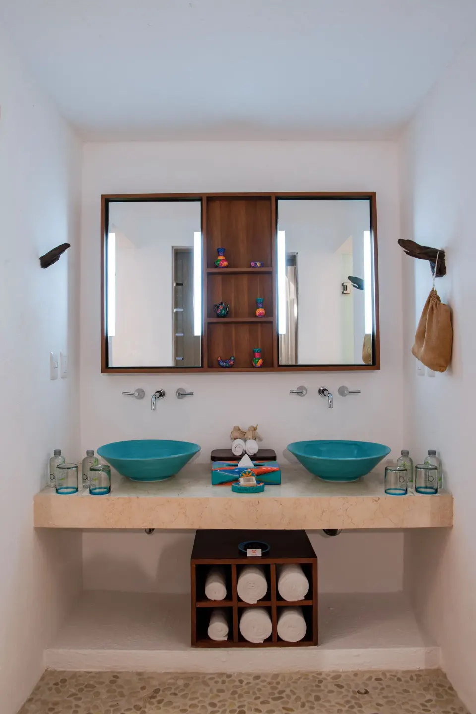 Double bathroom vanity with turquoise sinks at Mahekal Beach Front Resort & Spa.