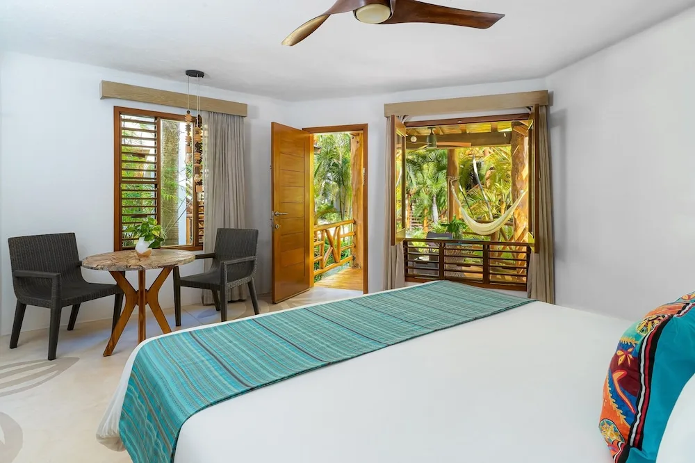 Oceanfront Plunge Pool room at Mahekal Beach Front Resort and Spa with king bed, private plunge pool, and direct Caribbean beachfront access in Playa del Carmen.