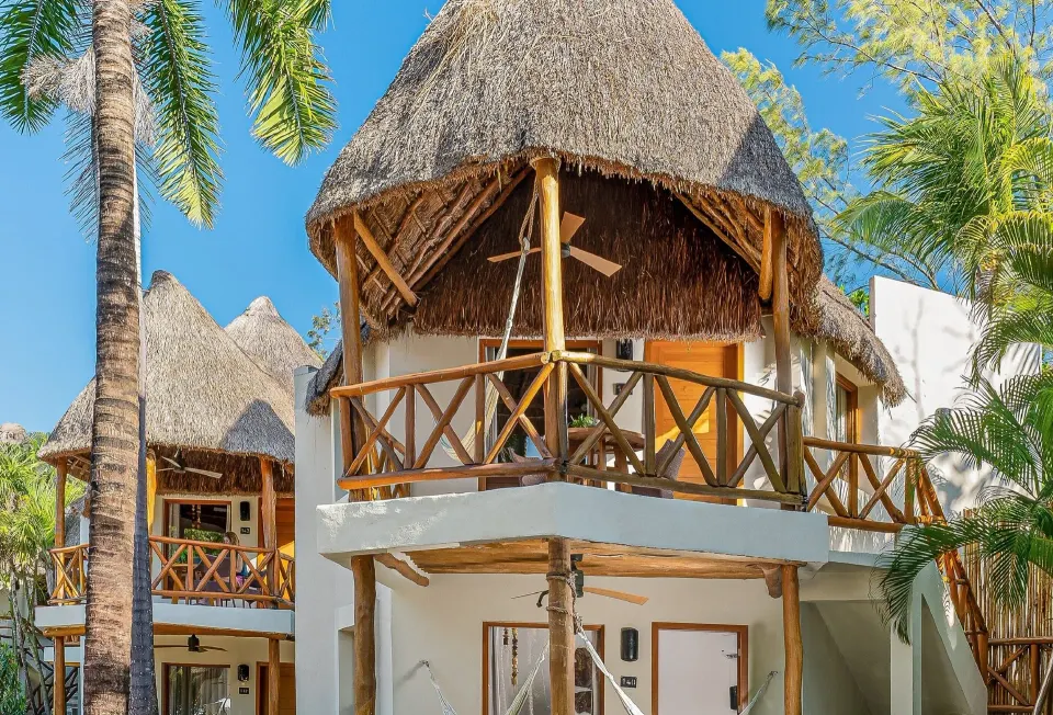 Ocean View Palapa exterior with thatched balconies at Mahekal Beach Front Resort & Spa.
