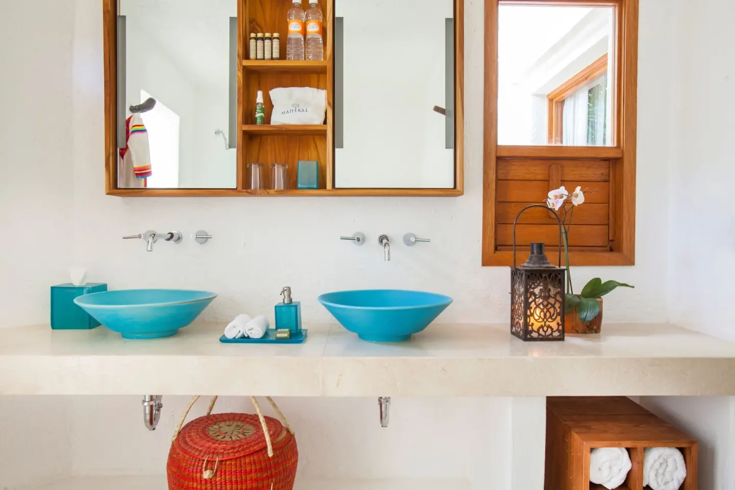 Garden View room bathroom with twin turquoise sinks at Mahekal Beach Front Resort & Spa.
