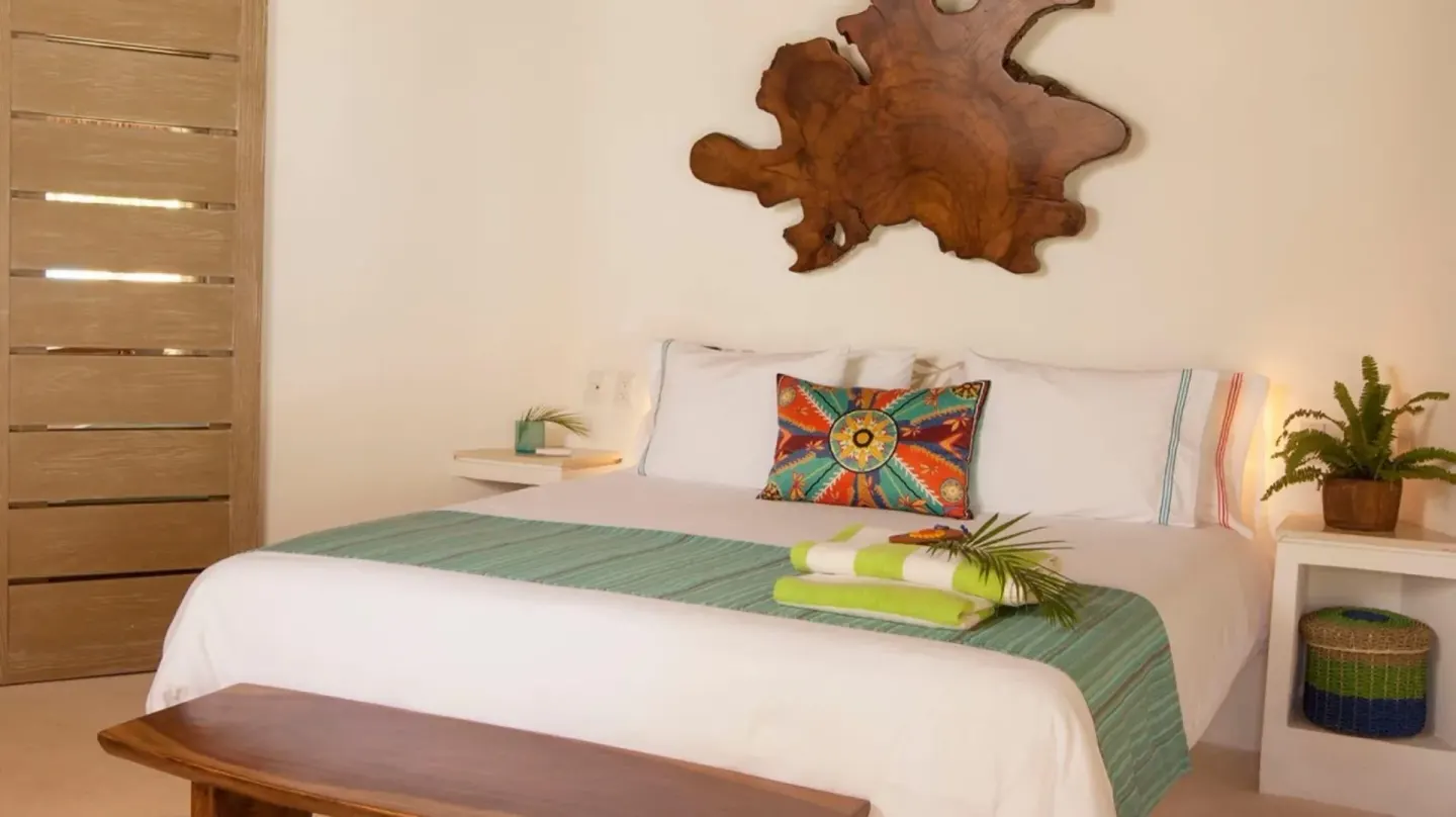 Run of House king guest room with white bedding at Mahekal Beach Front Resort & Spa.