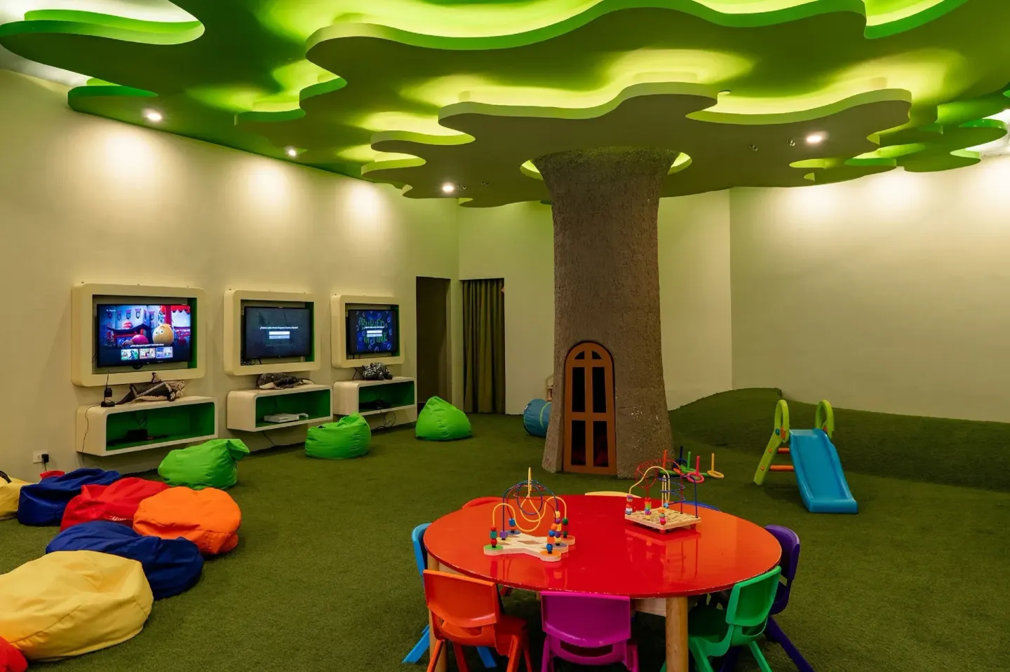Kids club playroom with games and colorful seating at Majestic Elegance Costa Mujeres.