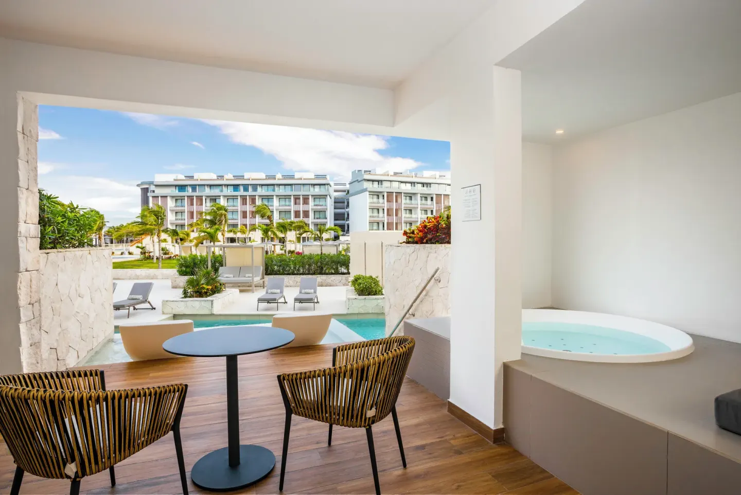 Elegance Club Majestic Elegance Costa Mujeres terrace with seating and whirlpool at Majestic Elegance Costa Mujeres.