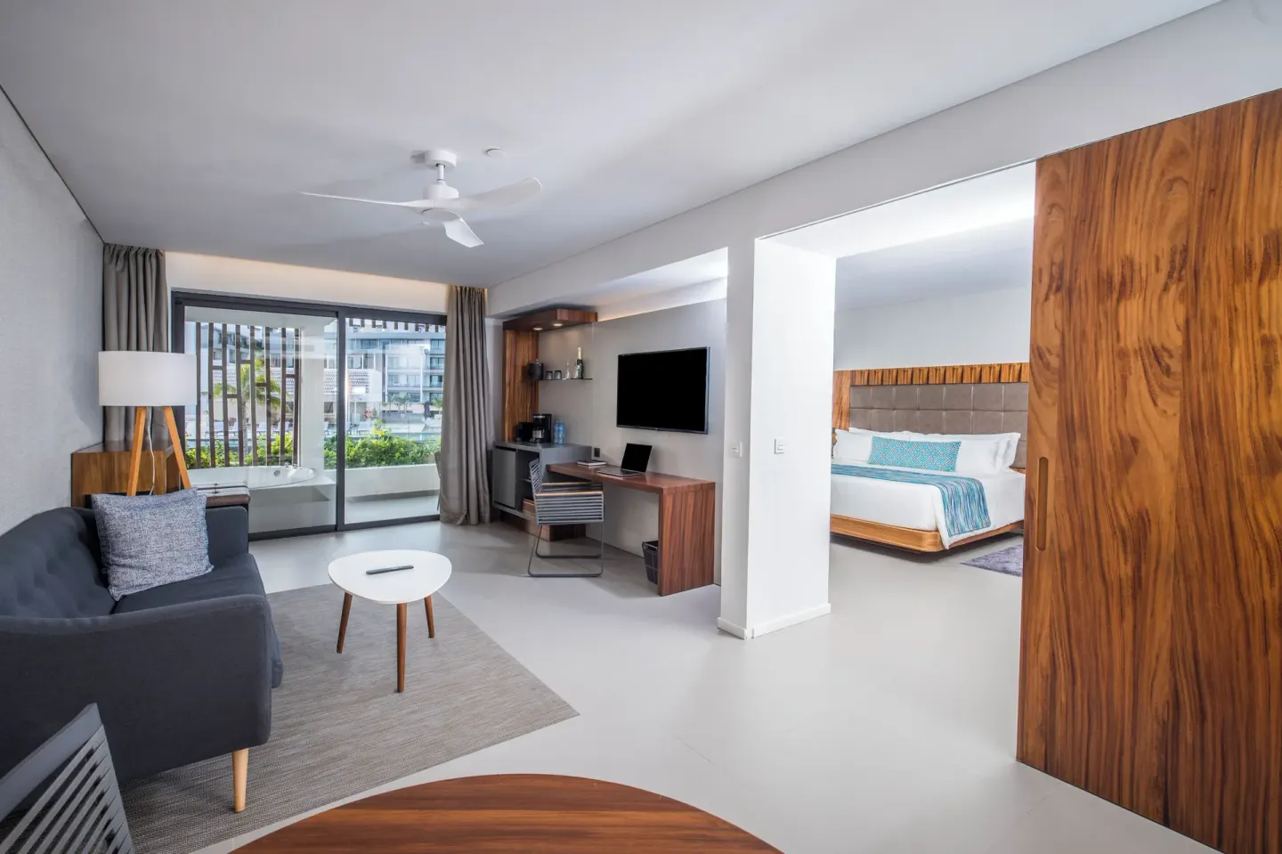 Elegance Club One Bedroom Suite living room and king bedroom at Majestic Elegance Costa Mujeres.