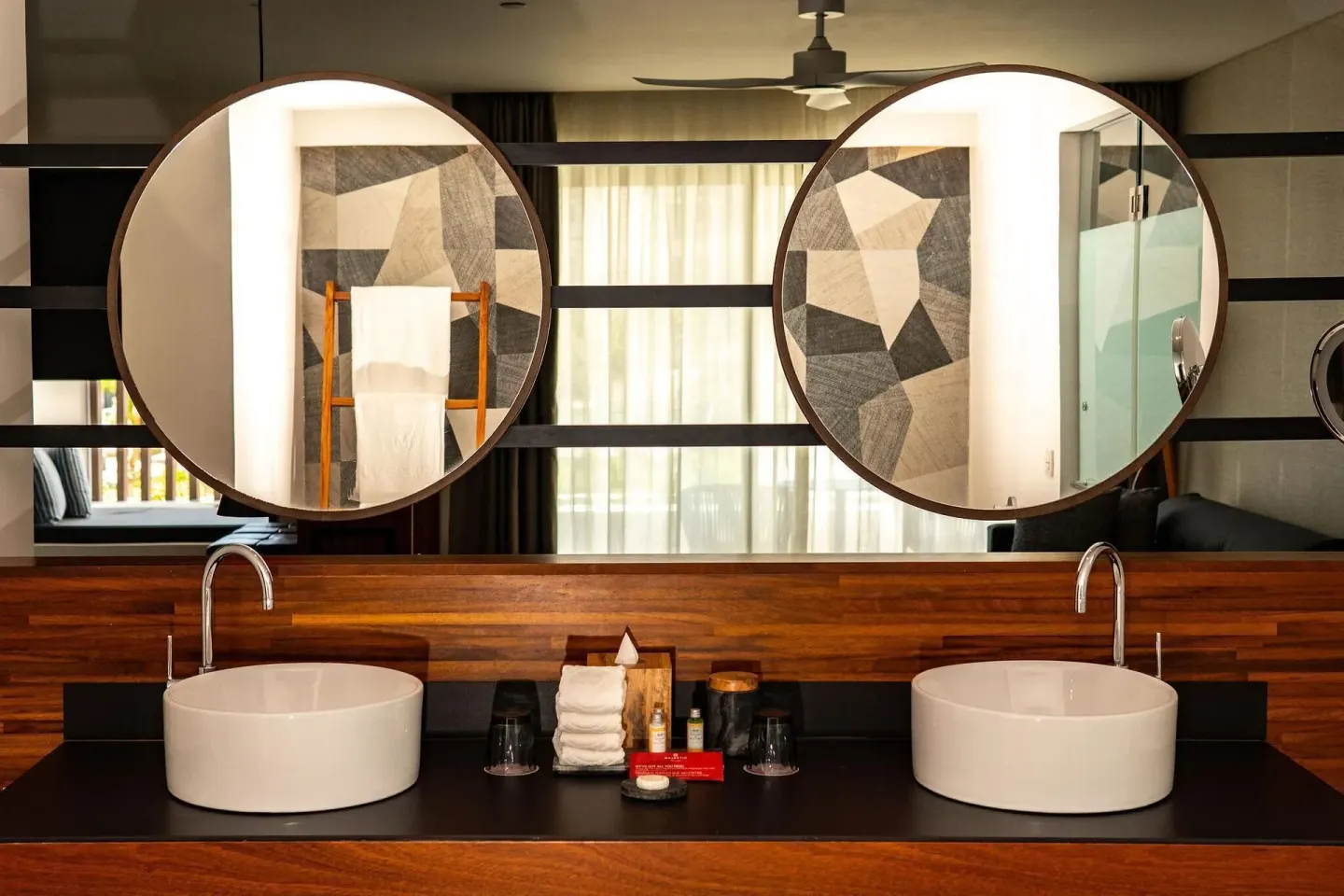 Majestic Elegance Costa Mujeres bathroom with double sinks at Majestic Elegance Costa Mujeres.