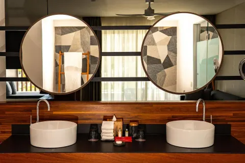 Majestic Elegance Costa Mujeres bathroom with double sinks at Majestic Elegance Costa Mujeres.