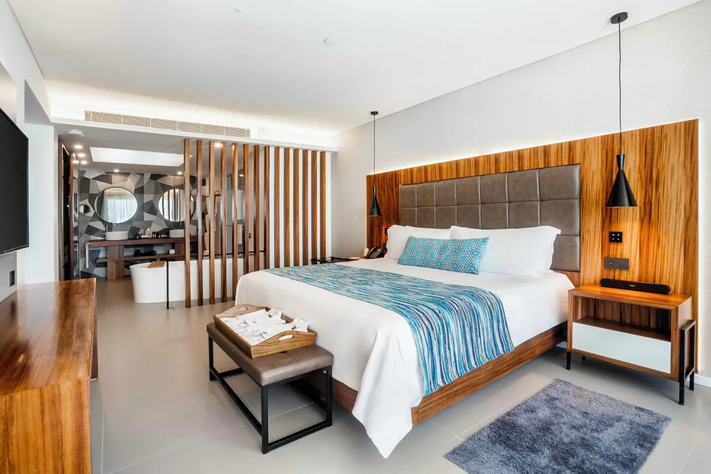 One Bedroom Suite with king bed and open bathroom at Majestic Elegance Costa Mujeres.