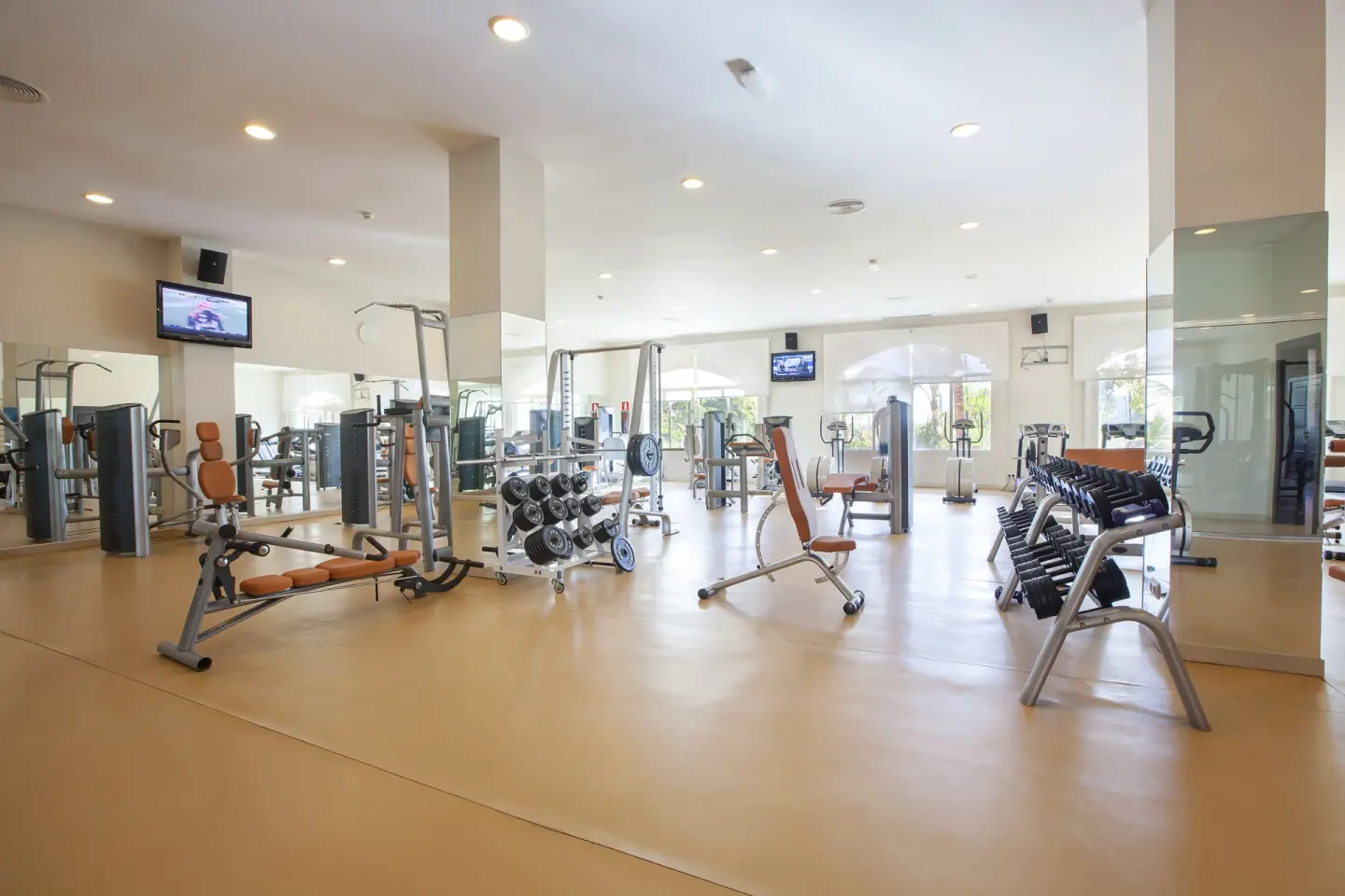 Weight and cardio equipment fill the fitness center at Majestic Elegance Punta Cana.