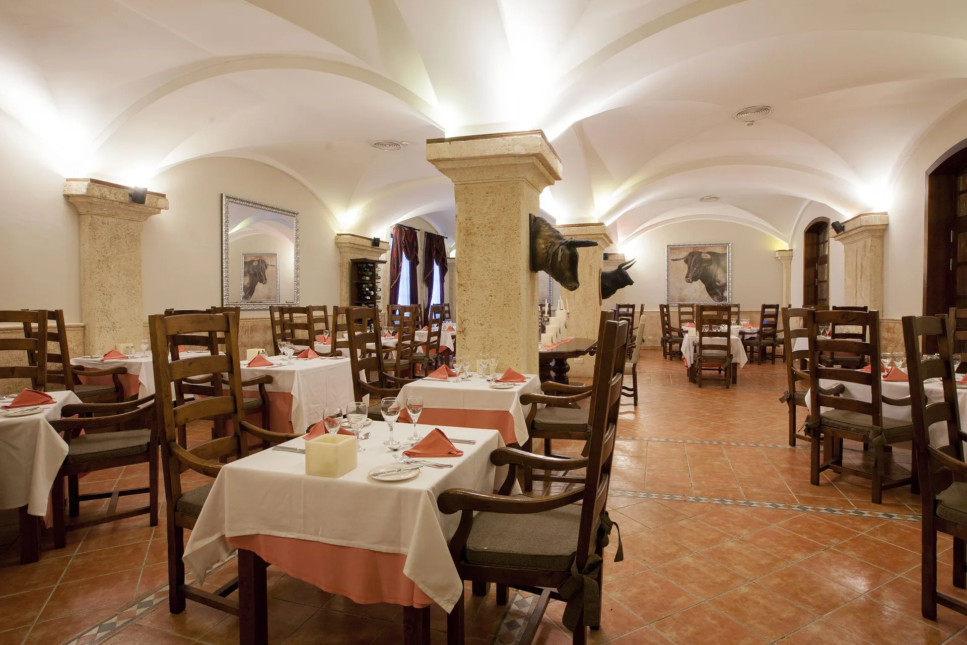 Steakhouse dining room with bull artwork at Majestic Elegance Punta Cana.