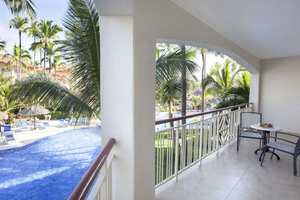 Colonial Junior Suite balcony overlooking the pool at Majestic Elegance Punta Cana.