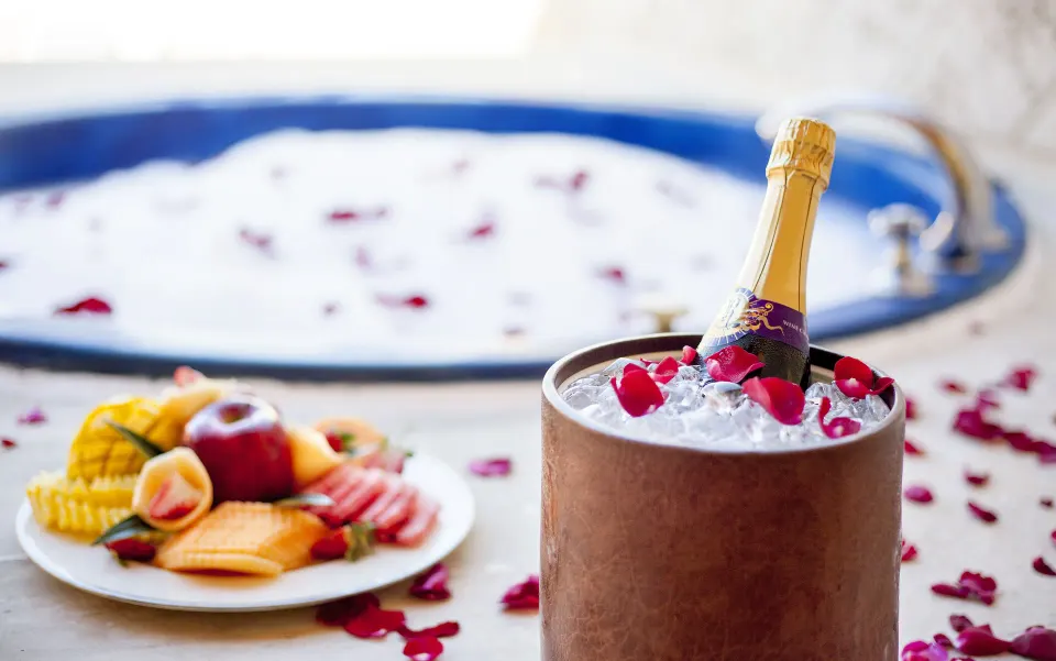 Colonial Junior Suite Jacuzzi detail with fruit and sparkling wine at Majestic Elegance Punta Cana.