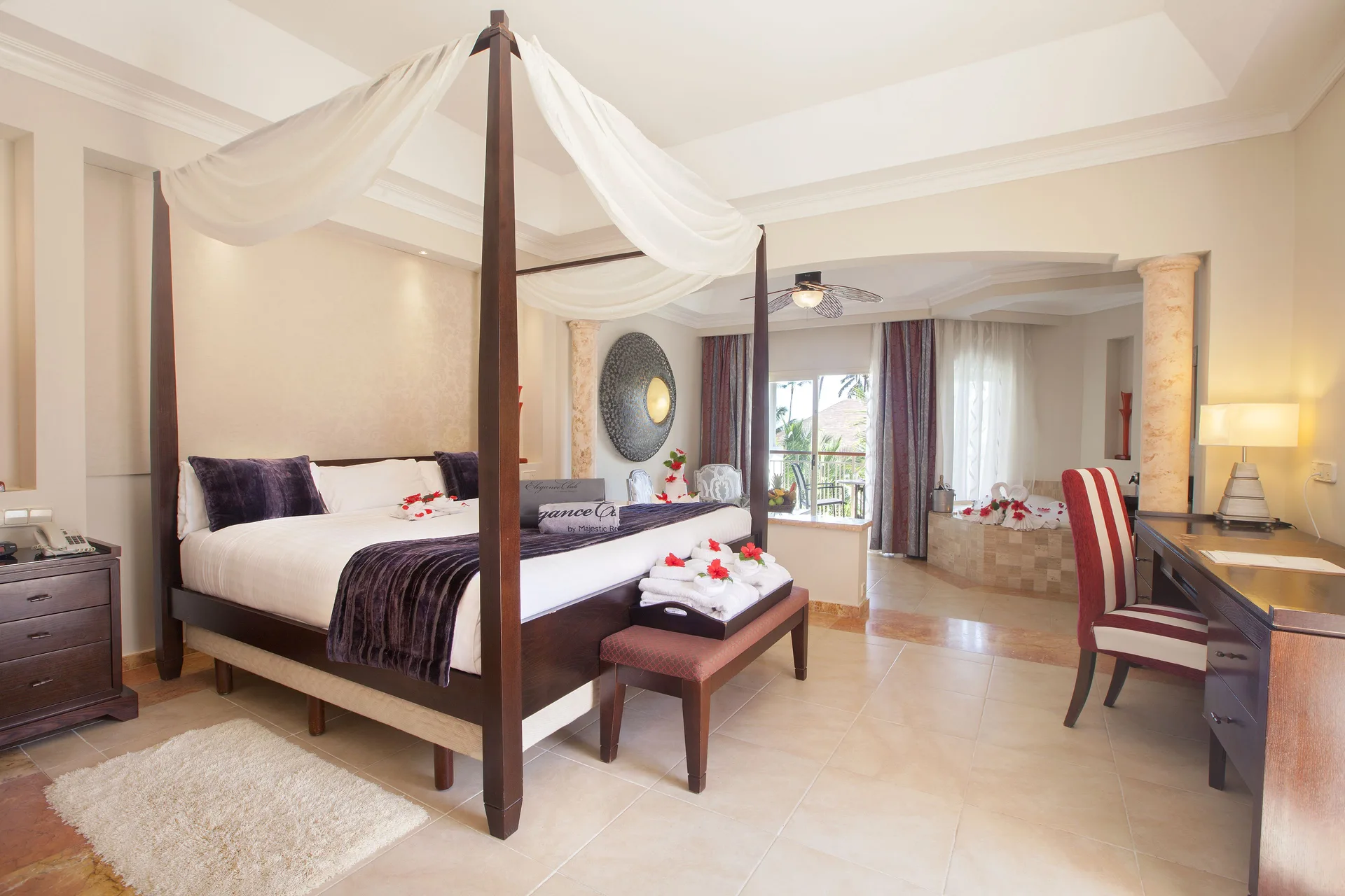 Elegance Club Junior Suite with four-poster bed at Majestic Elegance Punta Cana.
