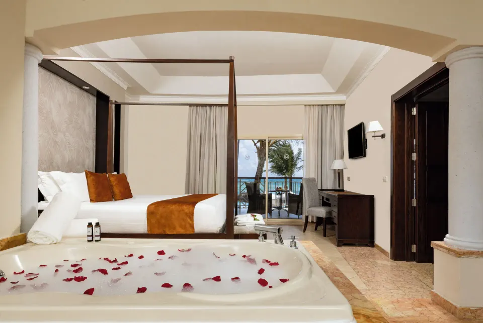 Elegance Club Ocean View Suite indoor jacuzzi and king bed at Majestic Elegance Punta Cana.