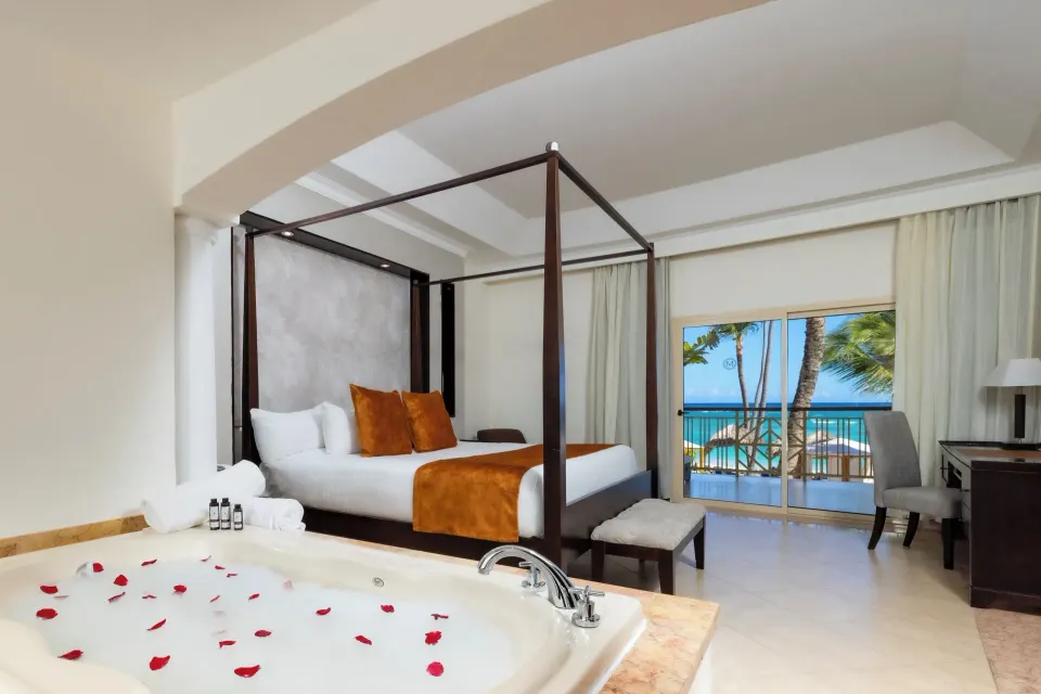 Elegance Club Ocean View Suite jacuzzi and king bed at Majestic Elegance Punta Cana.