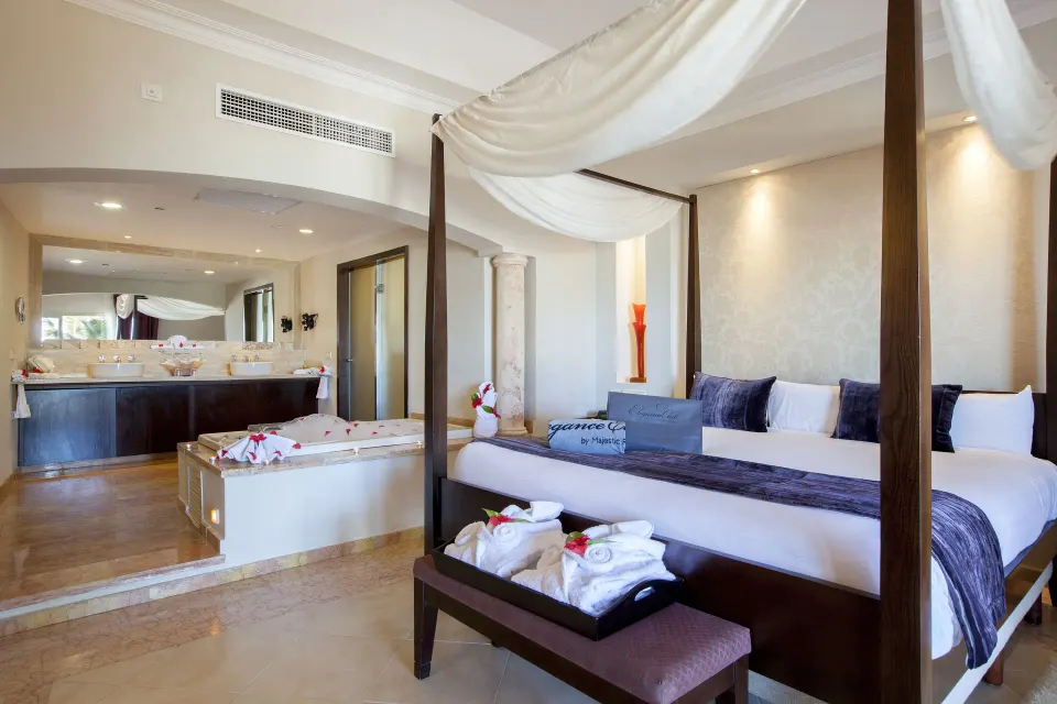 Elegance Club Ocean View Suite with canopy bed and indoor jacuzzi at Majestic Elegance Punta Cana.