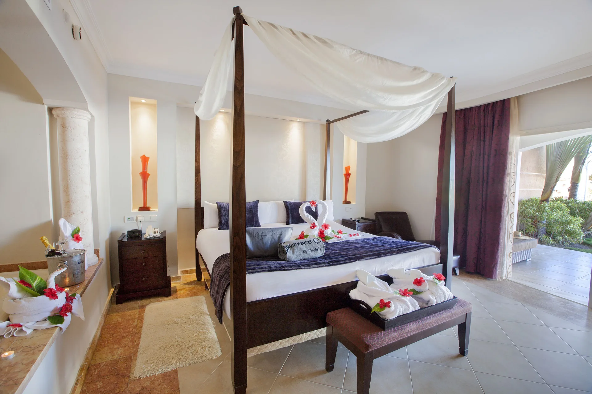 Four-poster king bed in an Elegance Club Swim Up Suite at Majestic Elegance Punta Cana.