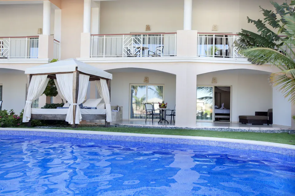 Swim-up suite building beside the pool at Majestic Elegance Punta Cana.