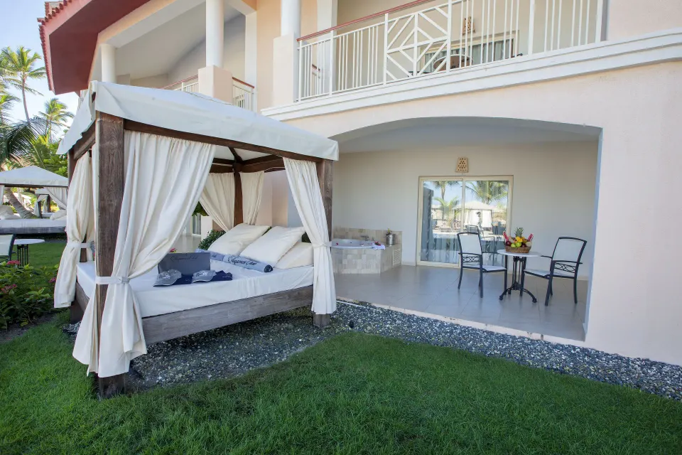Ground-floor terrace with daybed and Jacuzzi at Majestic Elegance Punta Cana.