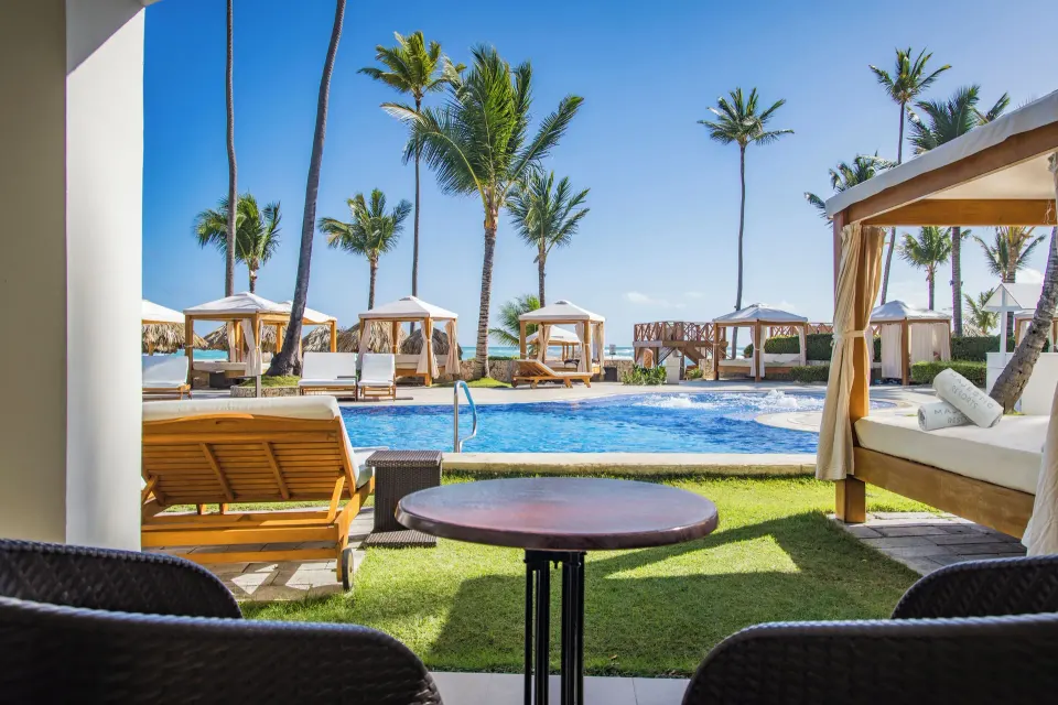 Terrace view of swim-up pool and cabanas at Majestic Elegance Punta Cana.