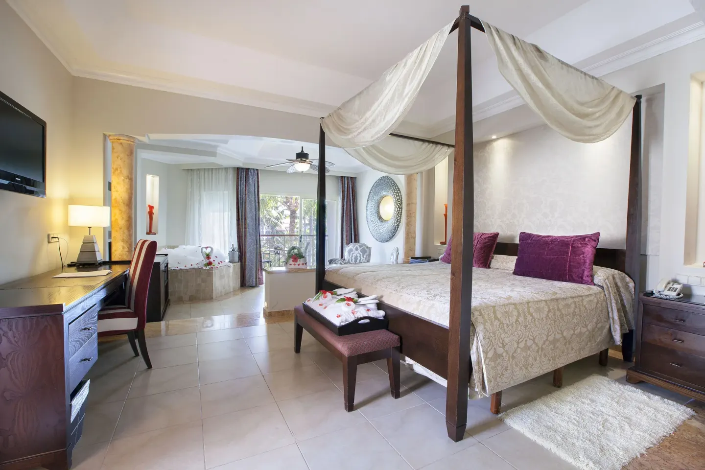 Junior Suite with Jacuzzi and canopy bed at Majestic Elegance Punta Cana.