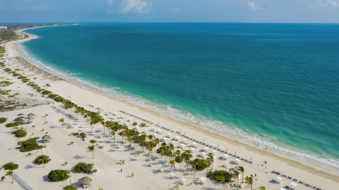 Aerial view of the beach and turquoise sea at Majestic Mirage Costa Mujeres.