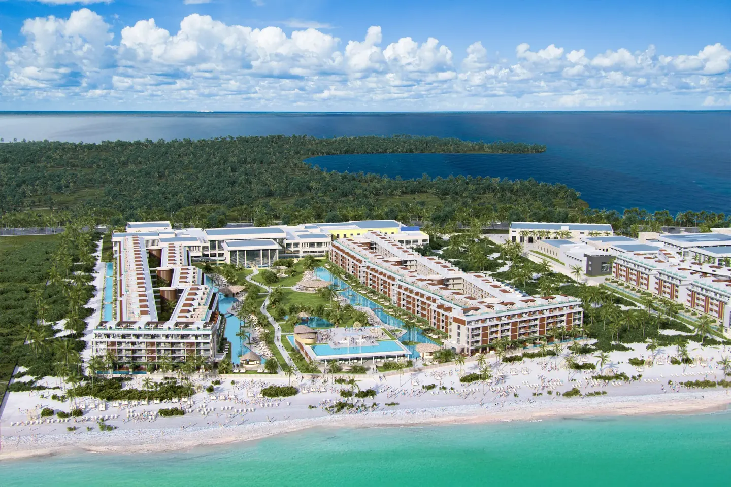 Aerial view of resort buildings, pools, beach, and ocean at Majestic Mirage Costa Mujeres.