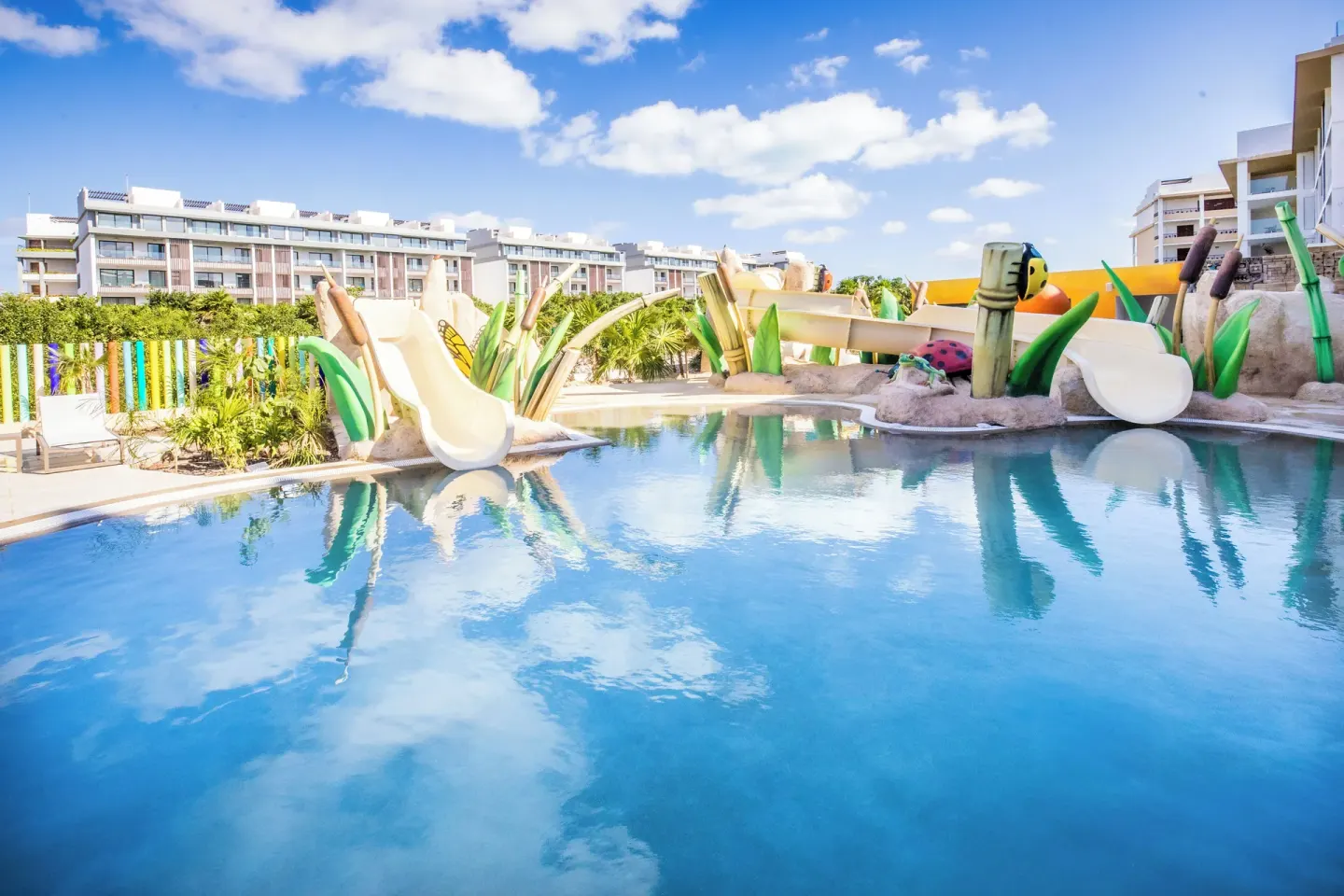 Children's splash pool with slides at Majestic Mirage Costa Mujeres.