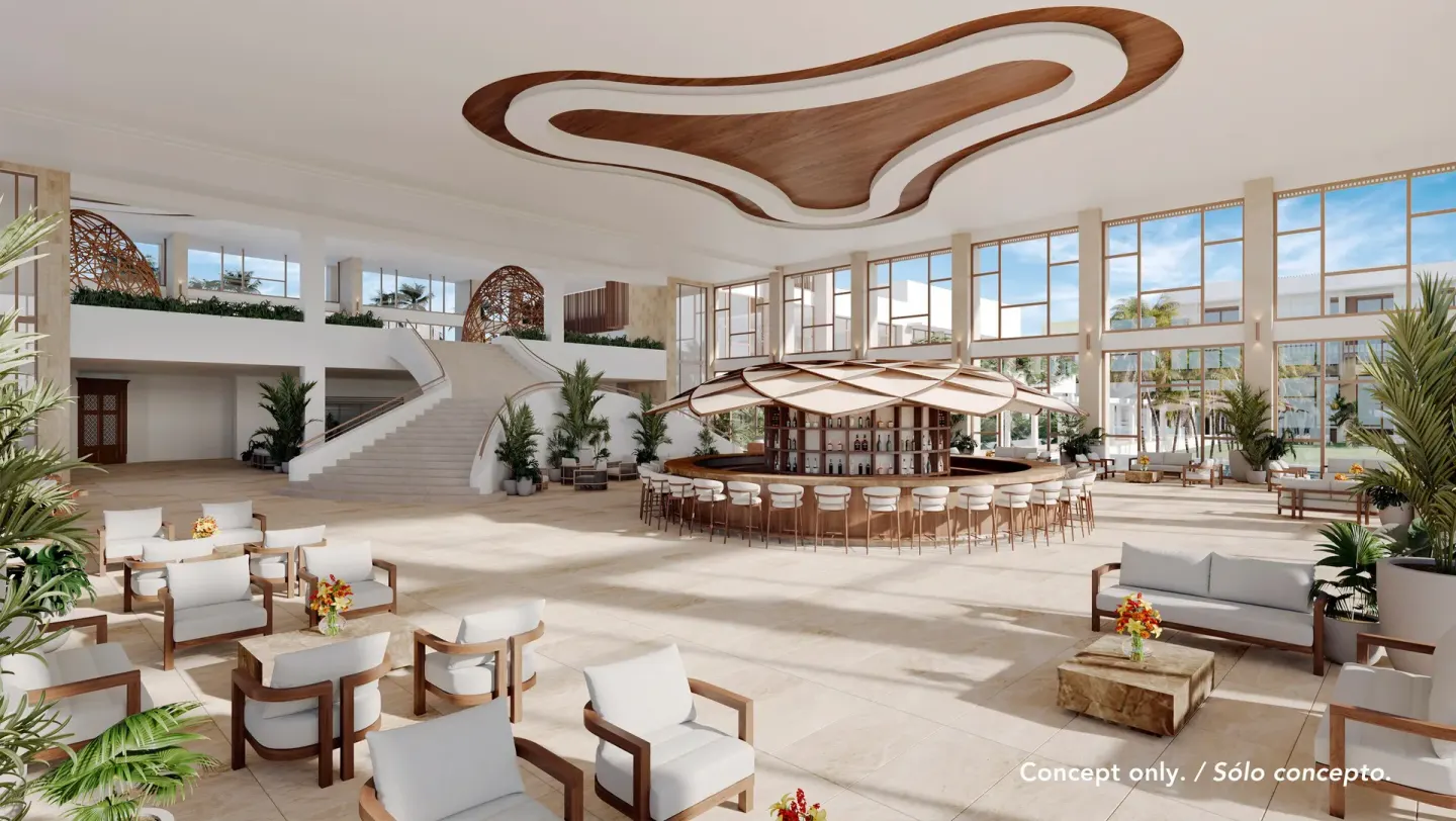 Open lobby lounge with a circular bar at Majestic Mirage Costa Mujeres.