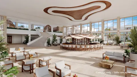 Open lobby lounge with a circular bar at Majestic Mirage Costa Mujeres.