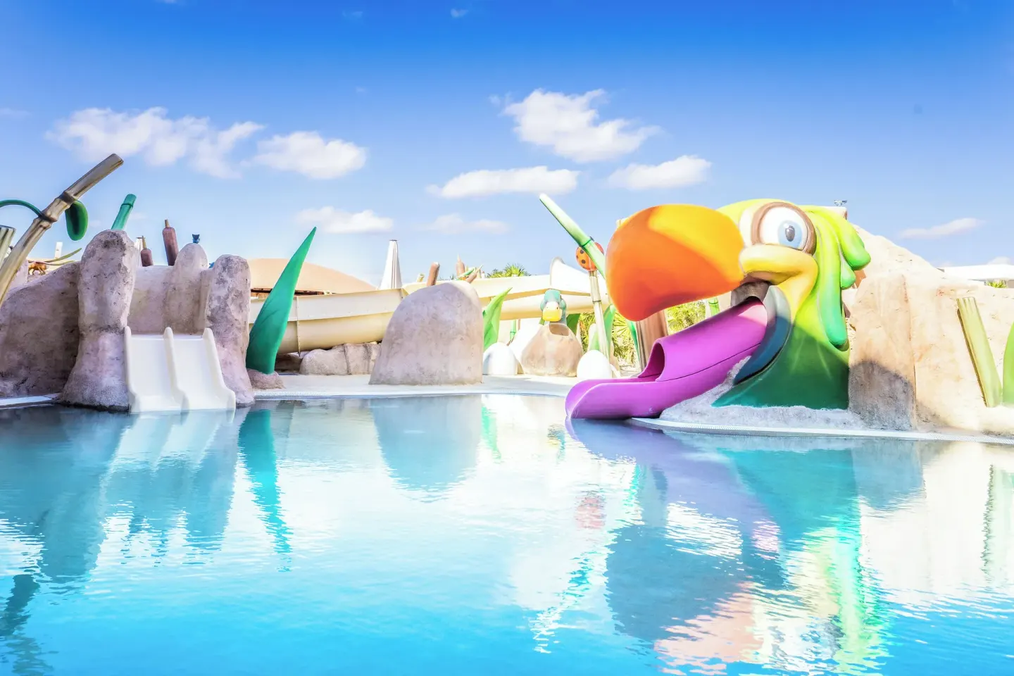 Toucan-themed children's water slide at Majestic Mirage Costa Mujeres.