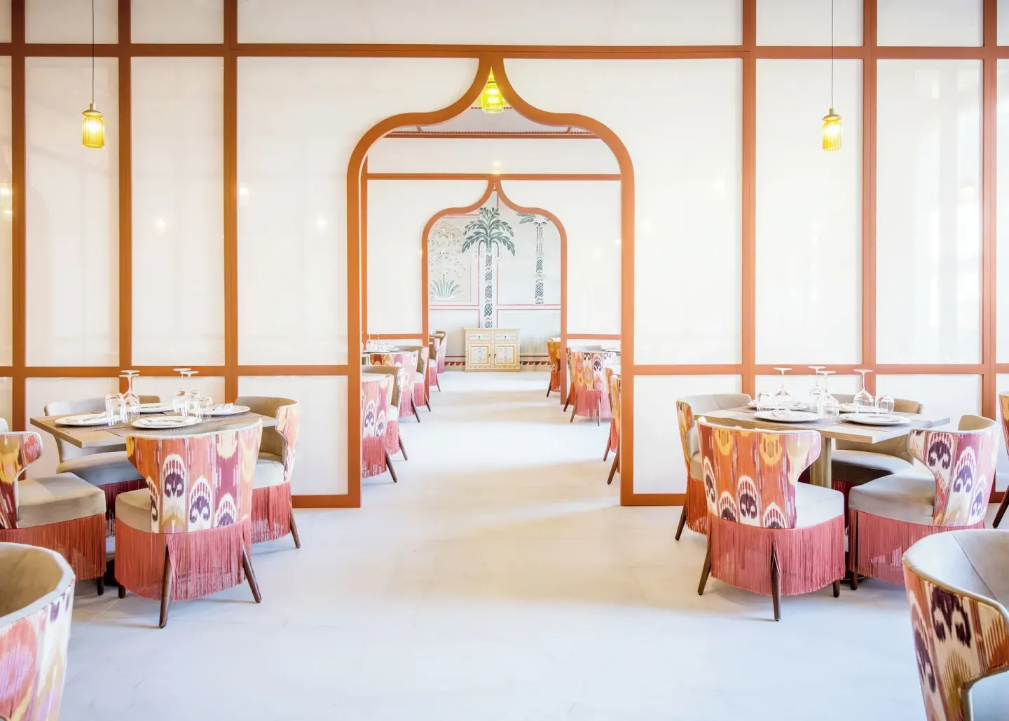 Patterned dining room with arched doorways at Majestic Mirage Costa Mujeres.
