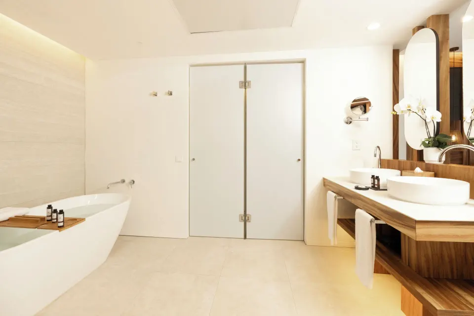 Family Club One Bedroom Suite bathroom with tub and vanity at Majestic Mirage Costa Mujeres.