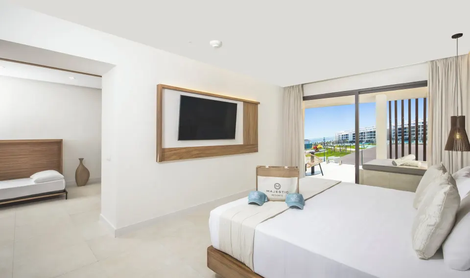 Family Club One Bedroom Suite king bed and balcony Jacuzzi at Majestic Mirage Costa Mujeres.