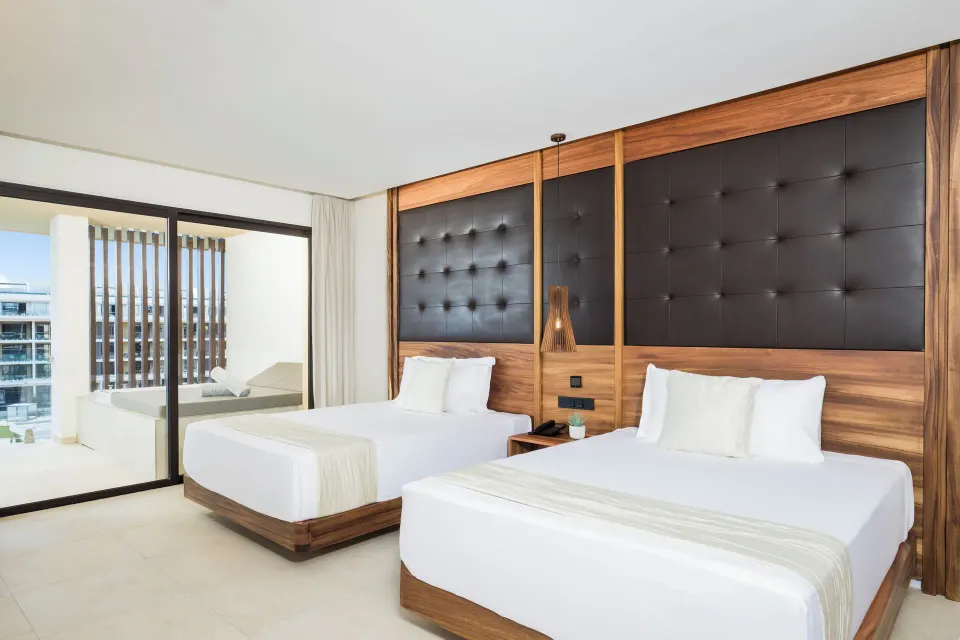 Family Club One Bedroom Suite two beds by balcony at Majestic Mirage Costa Mujeres.