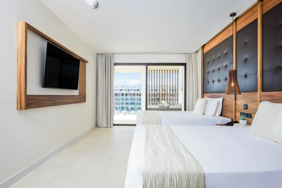Family Club One Bedroom Suite two queen beds and balcony at Majestic Mirage Costa Mujeres.